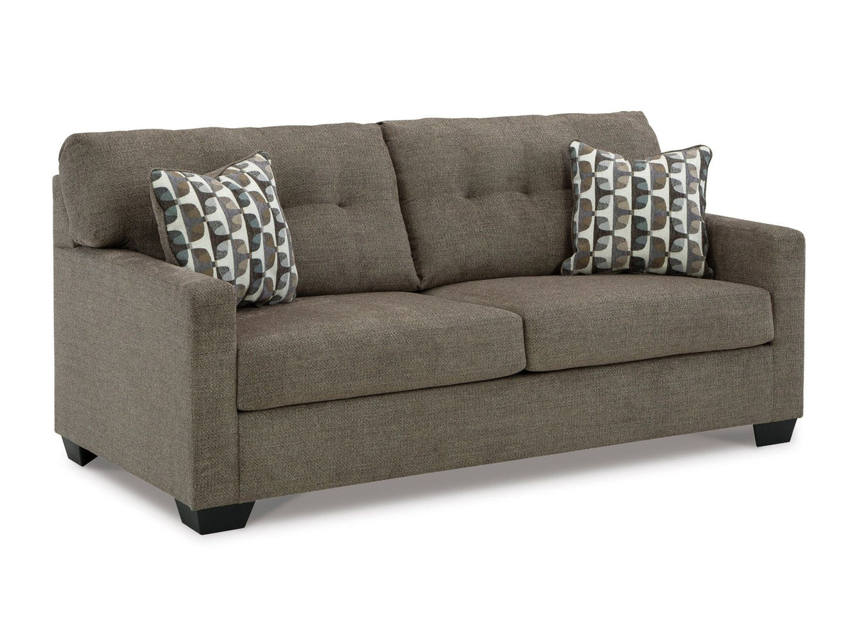 Gray sofa with patterned cushions on a white background