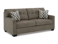 Gray sofa with patterned cushions on a white background