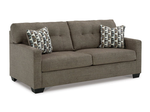Gray sofa with patterned cushions on a white background