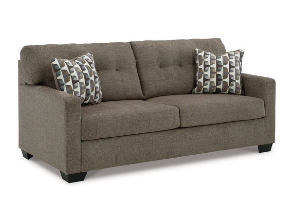 Gray sofa with patterned cushions on a white background
