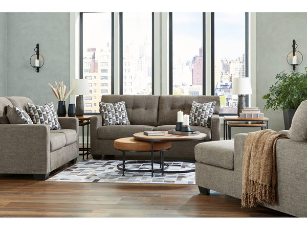Ashley 31005 living room with gray sofa, coffee table, and decorative items.