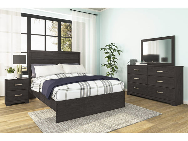 Ashley Belachime bedriim furniture set with bed, dresser, and nightstand in a room.