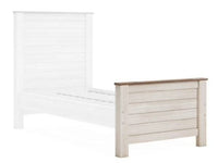 White Ashley Willowton twin bed frame with slatted design on a white background